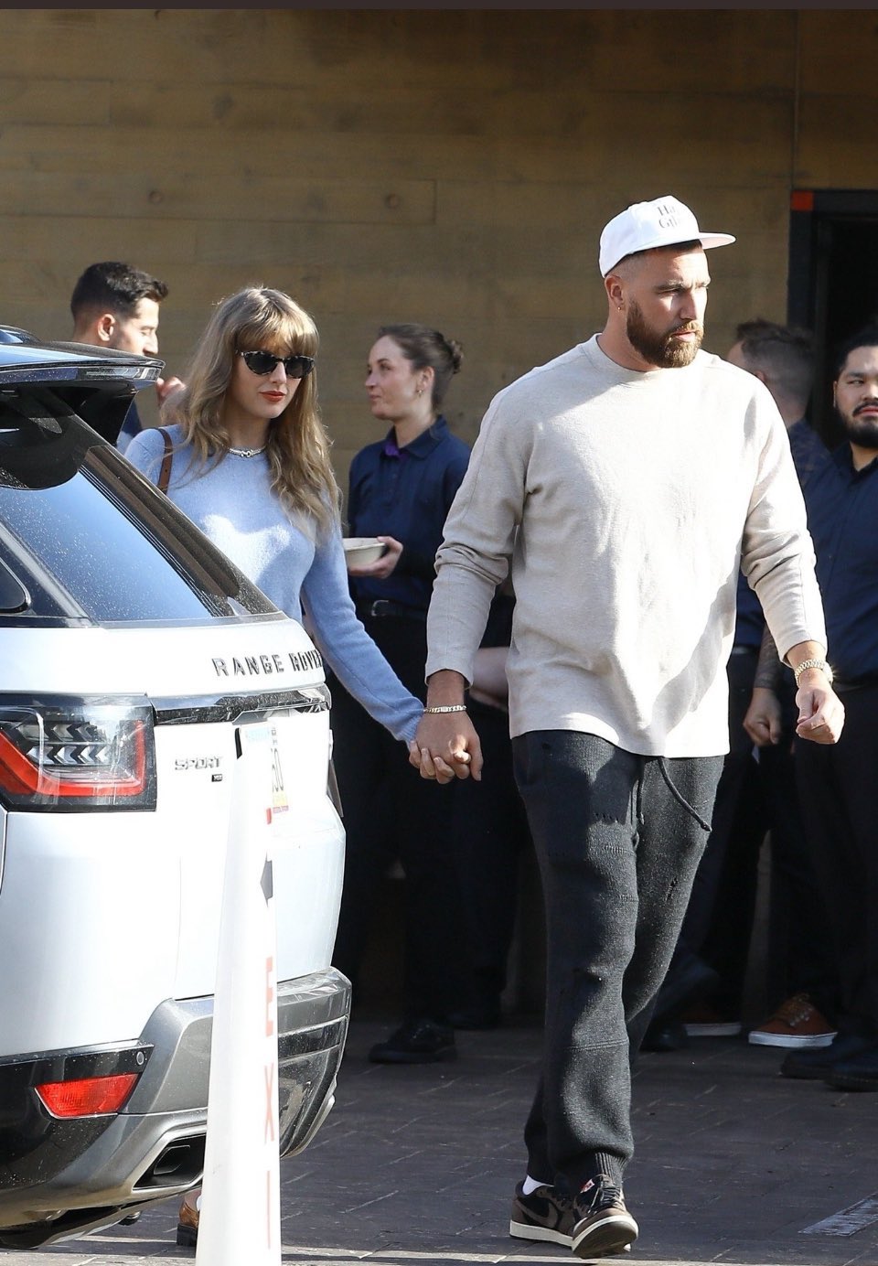 Taylor Swift holds hands with boyfriend Travis Kelce as they enjoy a romantic lunch date at Nobu in Malibu....after returning from Bahamas vacation