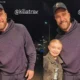 Travis Kelce is BACK in the United States after Taylor Swift Bahamas vacation as he poses for a picture with a young fan in Cleveland