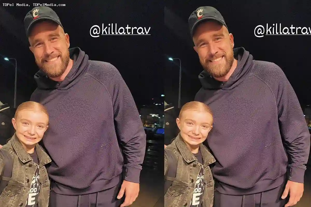 Travis Kelce is BACK in the United States after Taylor Swift Bahamas vacation as he poses for a picture with a young fan in Cleveland