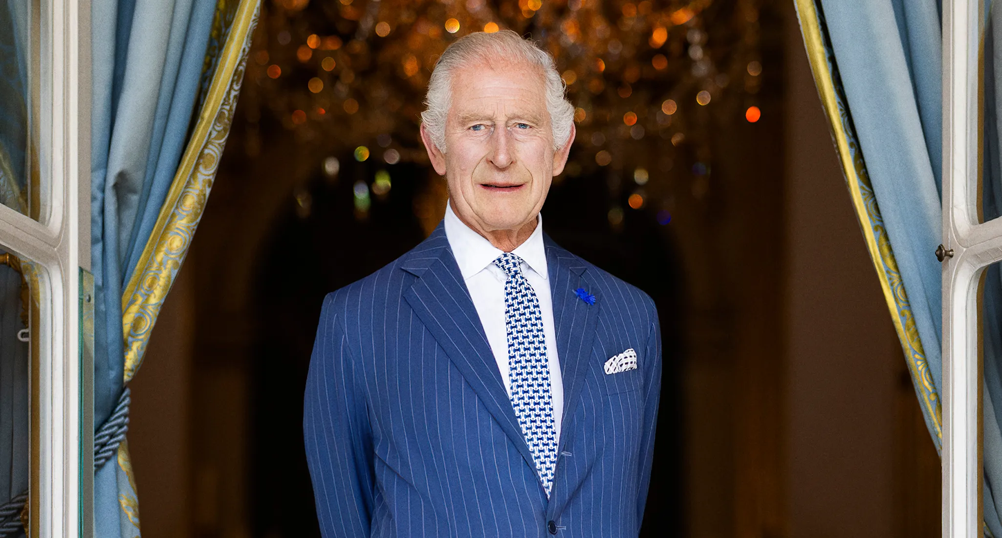 Striking New Royal Photo Shows King Charles Sitting Alone Recording a Message from Buckingham Palace, It was taken in Buckingham Palace's 18th Century Room