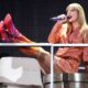 Taylor Swift Strips Down to Sparkly Bra and Hotpants for Onstage Quick-Change During Paris Eras Tour Show, Swift kicked off the European leg of her Eras Tour in a bunch of brand new outfits — including one very sexy two-piece set