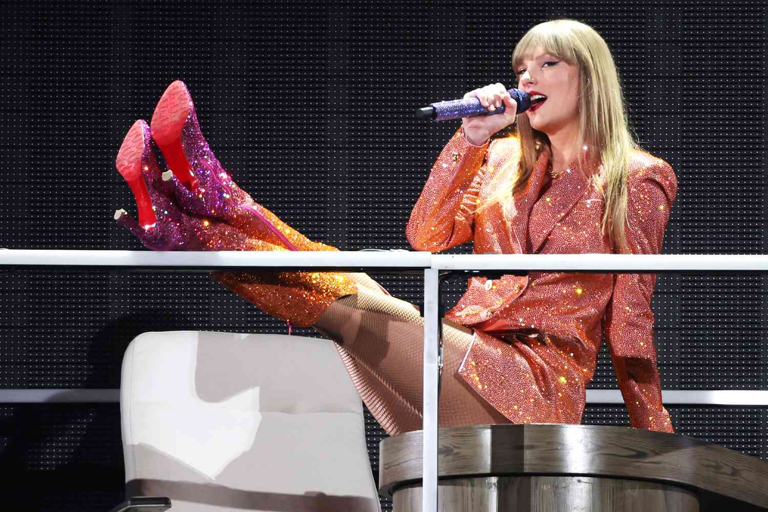 Taylor Swift Strips Down to Sparkly Bra and Hotpants for Onstage Quick-Change During Paris Eras Tour Show, Swift kicked off the European leg of her Eras Tour in a bunch of brand new outfits — including one very sexy two-piece set