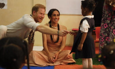 Prince Harry and Duchess Meghan are starting off their first trip to Nigeria with a lively fun visit to a school.