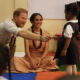 Prince Harry and Duchess Meghan are starting off their first trip to Nigeria with a lively fun visit to a school.