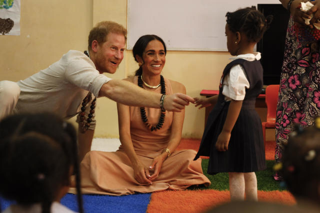 Prince Harry and Duchess Meghan are starting off their first trip to Nigeria with a lively fun visit to a school.