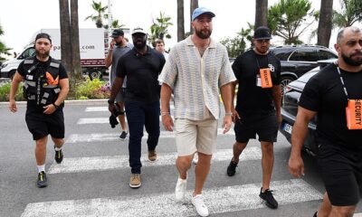 Travis Kelce wears a Fearless friendship bracelet at a Cannes Lions panel as he admits he's got 'more fans' thanks to girlfriend Taylor Swift's VERY dedicated following