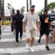 Travis Kelce wears a Fearless friendship bracelet at a Cannes Lions panel as he admits he's got 'more fans' thanks to girlfriend Taylor Swift's VERY dedicated following