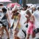 Taylor Swift fans brave the elements as the countdown begins for megastar's first UK Eras Tour concert in Edinburgh - after camping overnight to bag the best spots and merch