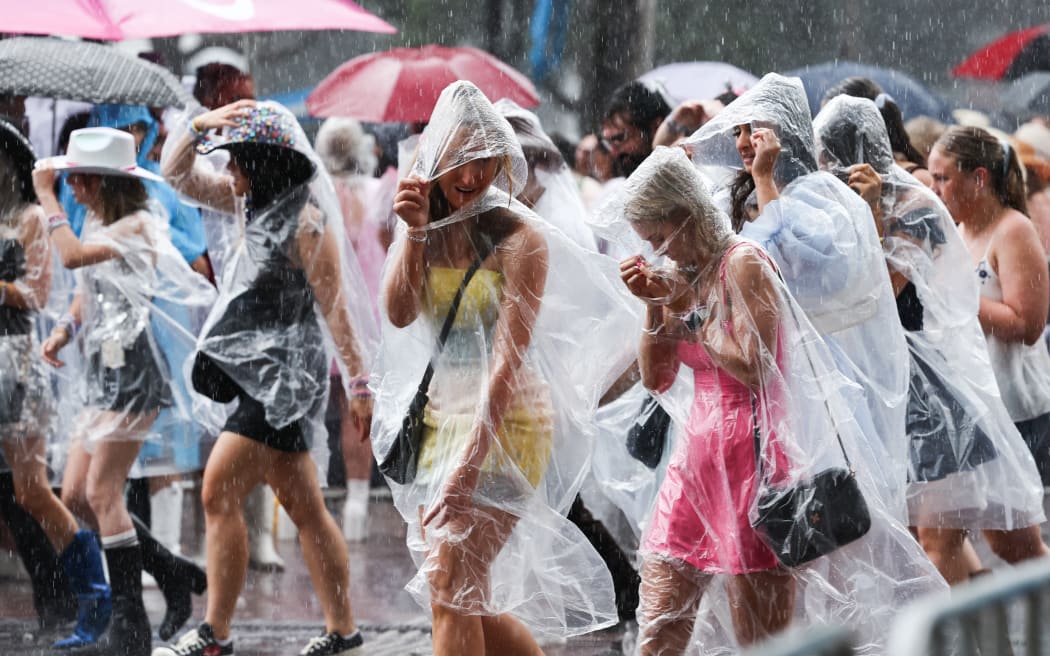 Taylor Swift fans brave the elements as the countdown begins for megastar's first UK Eras Tour concert in Edinburgh - after camping overnight to bag the best spots and merch