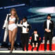 EXCLUSIVE: He's her No1 fan! Taylor Swift's Superbowl-winning fella Travis Kelce PERFORMS on stage with her at Wembley - carrying her across the stage then fanning her to the delight of the crowd