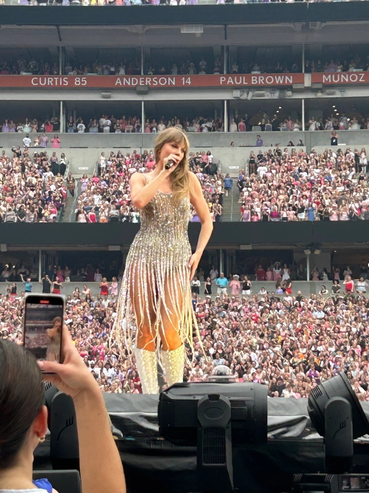 REVEALED: Best Taylor Swift view in the house! Fans agape as figures spotted dancing on the top of Wembley Stadium on the second night of her Eras tour - before arena reveals real reason they were in vertigo-inducing spot