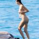 WATCH: Leonardo DiCaprio's girlfriend Vittoria Ceretti flaunts her model figure in a tiny pink bikini as she cools off with a dip in the sea during Italian holiday