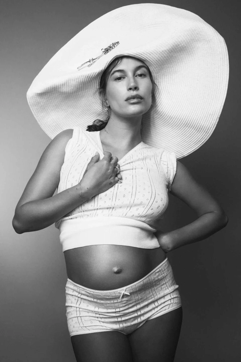 EXCLUSIVE: Pregnant Hailey Bieber Bares Baby Bump as She Admits She 'Didn't Enjoy the Stress' of 'Hiding' Pregnancy: "I felt like I was hiding this big secret, and...see more